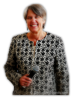 photo of Christine A. Padesky, PhD holding microphone
