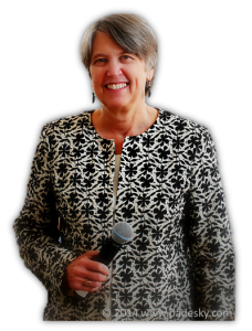 photo of Christine A. Padesky, PhD holding microphone