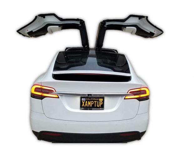 photo of tesla model x with both falcon doors wide open