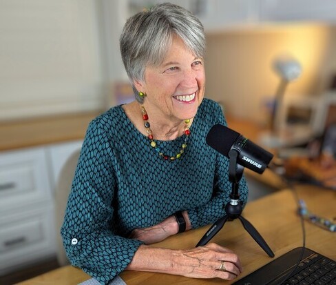 padesky at desk with microphone
